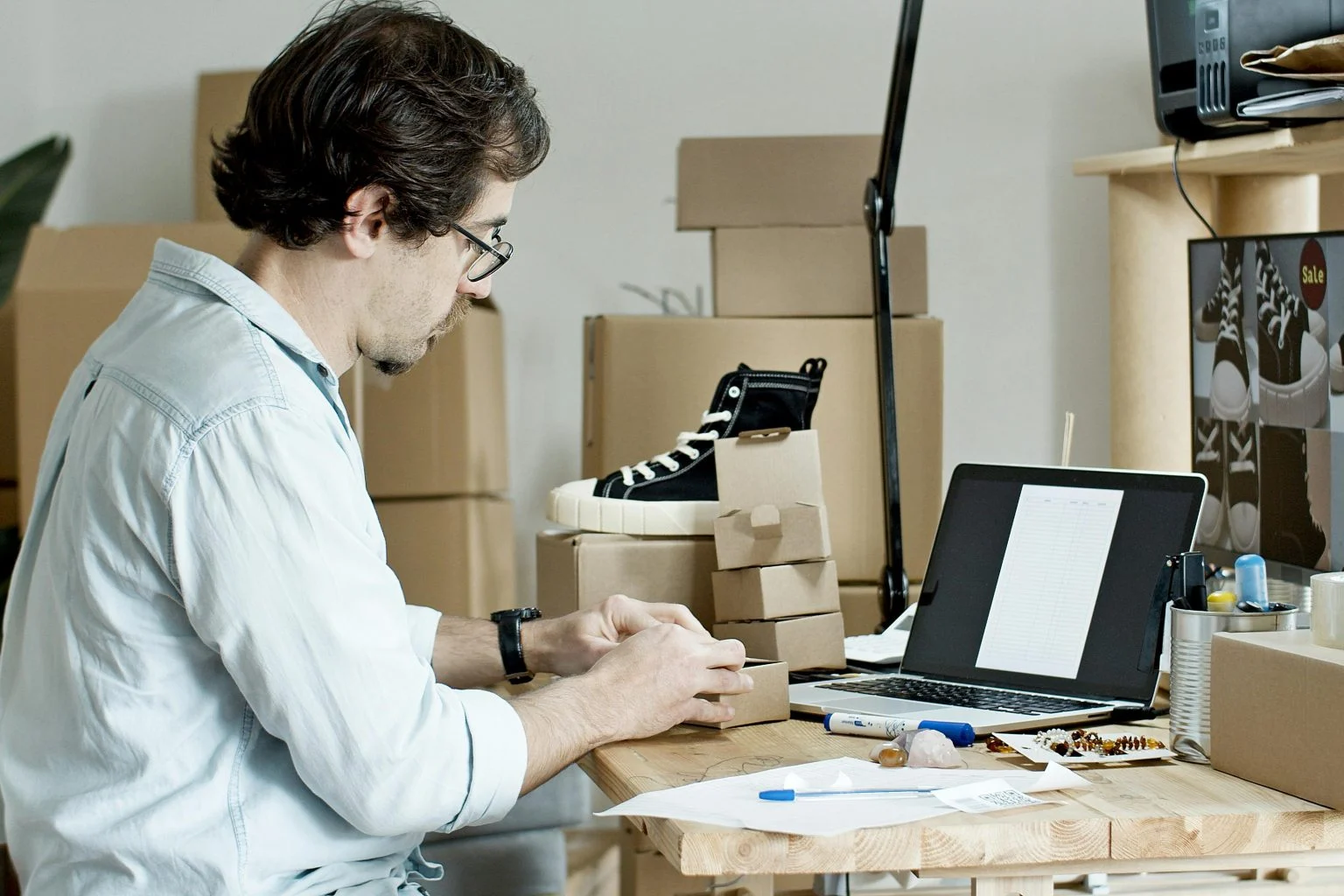 Businessman managing products for an online store representing WooCommerce custom product type development